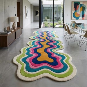 Colorful wavy abstract area rug featuring layered organic curves in green, turquoise, pink, navy blue, mustard yellow, and ivory. Plush raised tufted texture and sculptural irregular shape create a bold modern statement. Shown in a luxury hallway and on a neutral floor, this colorful area rug is ideal for living rooms, bedrooms, hallways, studios, offices, and contemporary interiors.