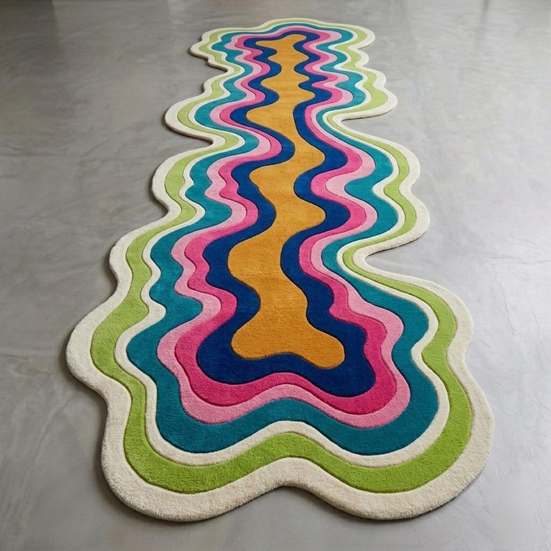 Colorful wavy abstract area rug featuring layered organic curves in green, turquoise, pink, navy blue, mustard yellow, and ivory. Plush raised tufted texture and sculptural irregular shape create a bold modern statement. Shown in a luxury hallway and on a neutral floor, this colorful area rug is ideal for living rooms, bedrooms, hallways, studios, offices, and contemporary interiors.
