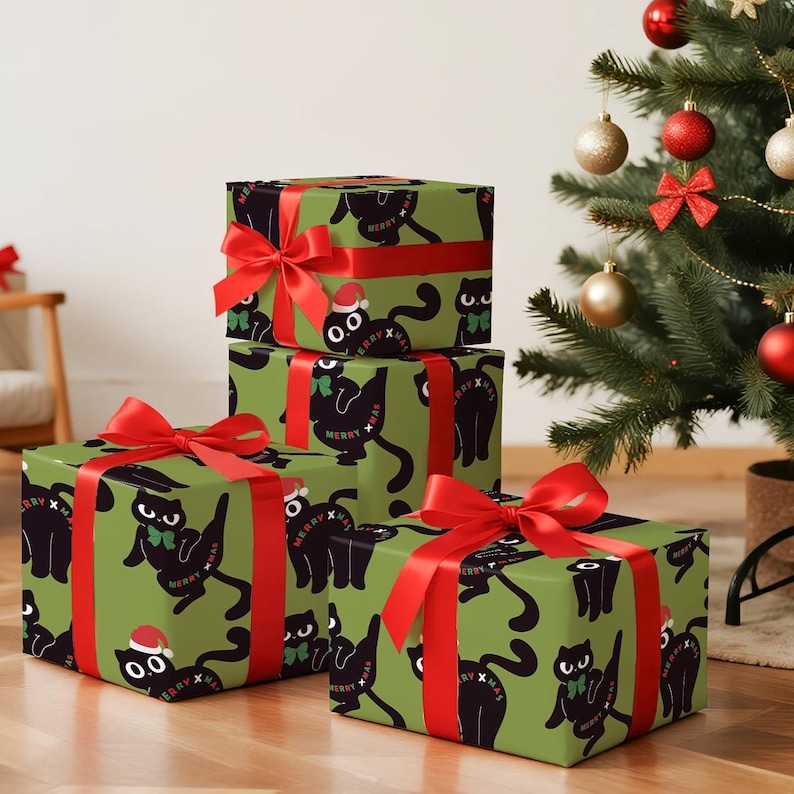 May include: Four wrapped gifts with red ribbons and bows are stacked. The wrapping paper is green with a repeating pattern of black cats wearing Santa hats and bow ties. The words "MERRY XMAS" are also printed on the wrapping paper.