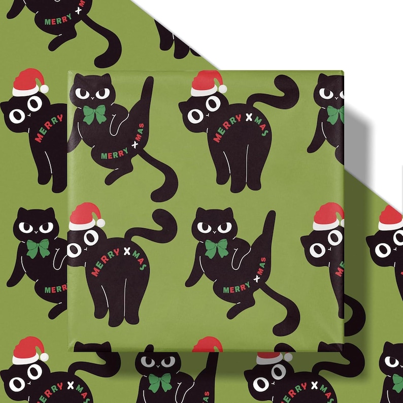 May include: Green wrapping paper with a repeating pattern of black cartoon cats wearing Santa hats and green bow ties. The words "Merry Xmas" are printed on the cats. The wrapping paper is folded over a gift.