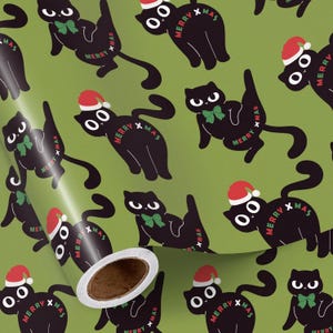 May include: Green wrapping paper with a repeating pattern of black cats wearing Santa hats and green bow ties. The words "MERRY XMAS" are printed on the cats. The roll of paper is partially unrolled, revealing the inside.