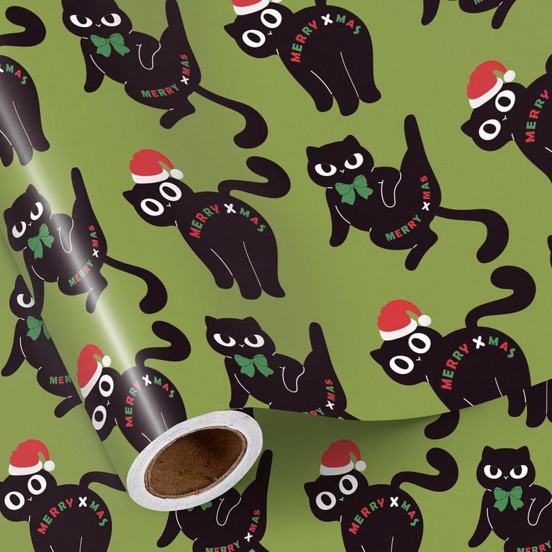 May include: Green wrapping paper with a repeating pattern of black cats wearing Santa hats and green bow ties. The words "MERRY XMAS" are printed on the cats. The roll of paper is partially unrolled, revealing the inside.