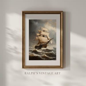 May include: A framed vintage print depicting a tall ship navigating a stormy sea. The artwork shows a detailed ship with billowing sails, set against a dramatic sky and turbulent waves. The frame is gold and the text "RALPH'S VINTAGE ART" is at the bottom.