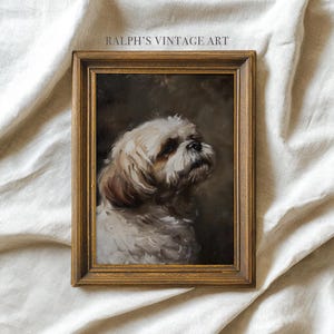 May include: A framed vintage portrait of a small dog with white and tan fur, gazing upwards. The artwork is in a gold-toned wooden frame. The text "RALPH'S VINTAGE ART" is printed at the top of the frame.
