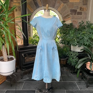blue dress with bow in front Alfred Sung Midnight Navy Bow Bridesmaid Dresses