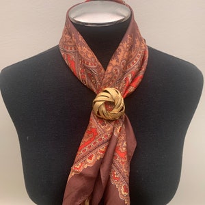 Spilla vintage a forma di girandola in oro spazzolato degli anni &#39;60 firmata Coro, spilla vintage, spilla vintage color oro, spilla firmata Coro Designer