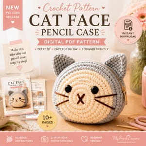 May include: A digital PDF crochet pattern for a cat face pencil case. The image displays a finished gray and cream crocheted cat pouch with black button eyes and embroidered whiskers, alongside a printed instruction booklet with 10+ pages.