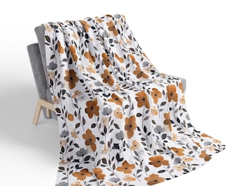 Manta de sherpa de forro polar con estampado floral color óxido / Flores naranjas, hojas neutras