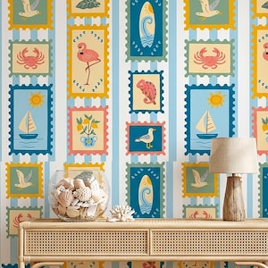 May include: Wallpaper with a repeating pattern of postage stamp-style illustrations with beach and ocean themes. Stamps include images of flamingos, sailboats, surfboards, and crabs. The background has blue and white vertical stripes.