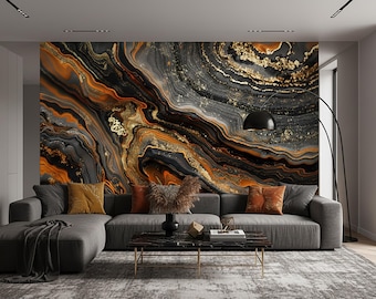 May include: A modern living room featuring a gray sectional sofa with orange and yellow throw pillows. The focal point is a large wall mural with a swirling pattern in black, orange, and gold tones. A black floor lamp and coffee table complete the space.