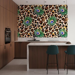 May include: A modern kitchen with dark wood cabinetry and a white countertop island. The focal point is a wall covered in wallpaper featuring a leopard print background with peacock feather accents. Two teal bar stools are positioned at the island.