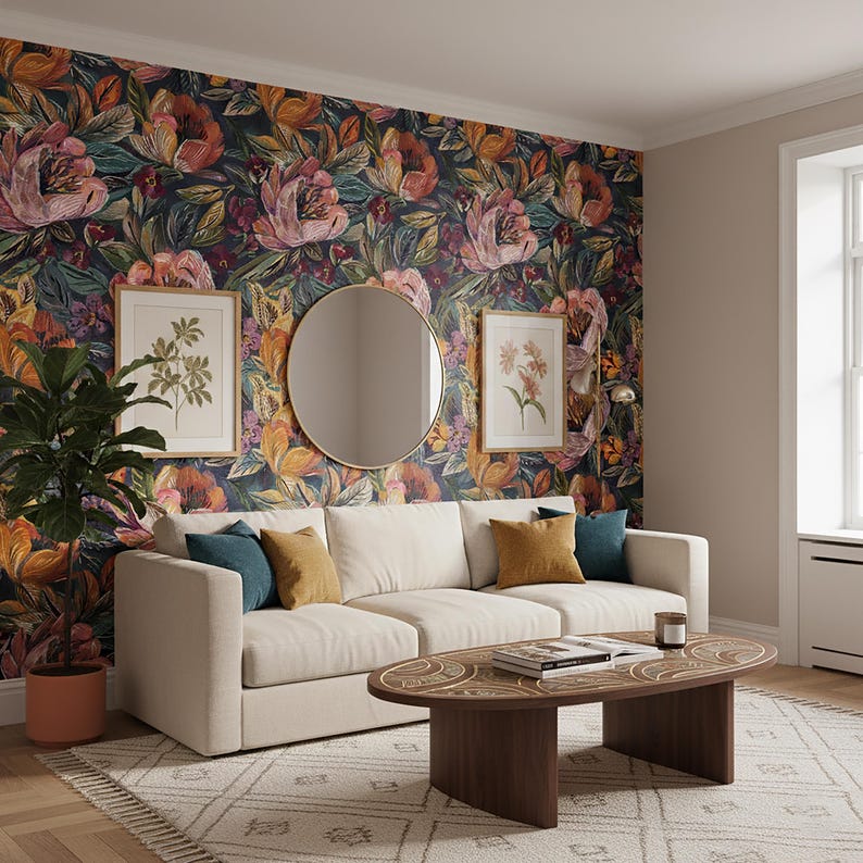 May include: A living room with a cream sofa, colourful cushions, a dark wood coffee table, and a patterned rug. The wall features floral wallpaper, framed botanical prints, and a round mirror, creating a vibrant and inviting atmosphere.