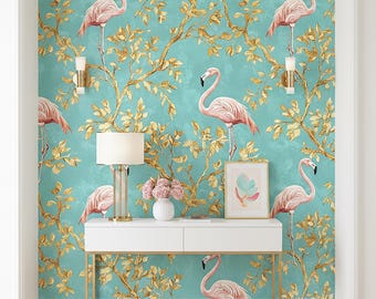 May include: A teal wallpaper featuring pink flamingos and gold-colored tree branches. A white console table with a gold frame is in front of the wallpaper. A white lamp, pink flowers, and a framed picture are on the table.