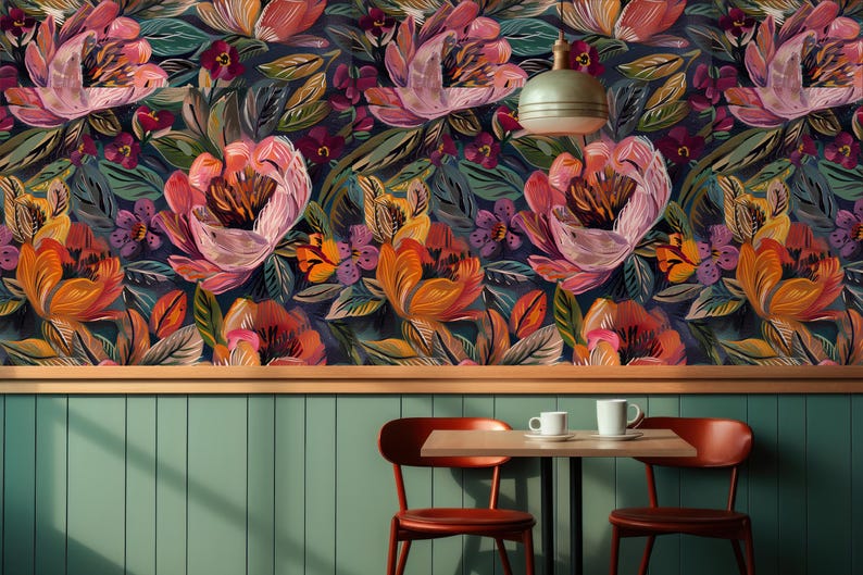 May include: Floral wallpaper with large, stylised flowers in pink, orange, and purple against a dark blue backdrop. The design includes green leaves and smaller purple flowers. The wallpaper is mounted above a wooden trim and a green paneled wall.