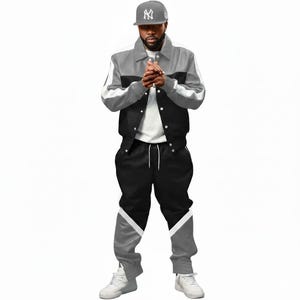 May include: A gray, black, and white track suit. The jacket is gray on top, black in the middle, and has white stripes on the sleeves. The pants are black with gray and white accents. A gray baseball cap with a logo is also visible.