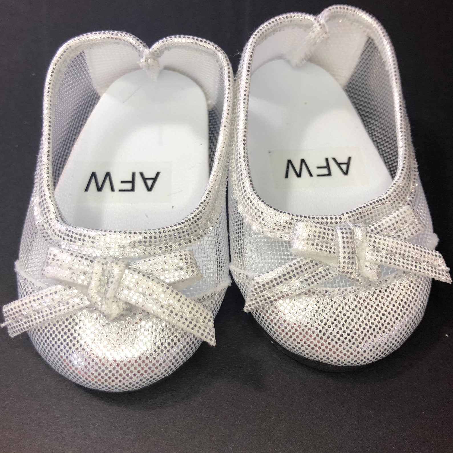 silver flats with bow
