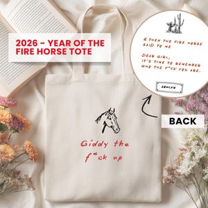 May include: Off-white tote bag with a horse head illustration and the text "Giddy the f*ck up" in red. The text "2026 - YEAR OF THE FIRE HORSE TOTE" is at the top. The back of the bag has a circular design with text.