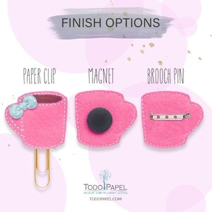 May include: Three pink felt coffee cup ornaments with different finishes: paper clip, magnet, and brooch pin. The text "FINISH OPTIONS" is at the top of the image. The text "PAPER CLIP", "MAGNET", and "BROOCH PIN" are below each ornament.