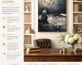 May include: An abstract art print featuring a figure gazing at a large, golden moon. The artwork is framed in gold and hangs above a wooden desk with books, a leather chair, and a vase of white flowers. The text reads "ART THAT SPEAKS. SPACES THAT INSPIRE."