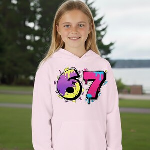 6 7 Hello Kitty Collage Youth Hoodie | Kids 6 7 Graffiti Style Font In Front And Hello Kitty Graphic Design On Back | Hello Kitty Six Seven image 2