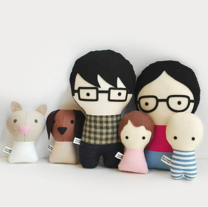 Custom made dolls resembling your beloved ones. The picture shows a sample of a couple with two babies a cat and a dog. You can add glasses, beard, chose hair color and style, and the fabrics for top and bottom. Made out of cotton and wool felt.