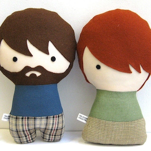 Custom made dolls resembling your beloved ones. The picture shows a sample of a man with beard and a woman with bangs. You can add glasses, beard, hair color and style, and chose the fabrics for top and bottom. Made out of cotton and wool felt.