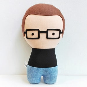 Custom made doll resembling your beloved one. the picture shows a sample. You can add glasses, beard, hair color and style, and chose the fabrics for top and bottom (skirt or pants). Made out of cotton and wool felt.