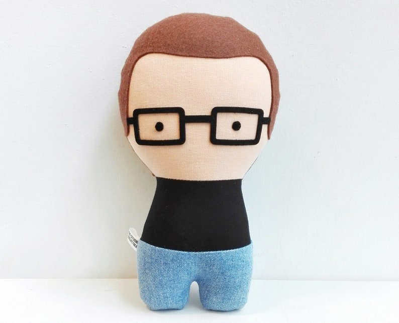 Custom made doll resembling your beloved one. the picture shows a sample. You can add glasses, beard, hair color and style, and chose the fabrics for top and bottom (skirt or pants). Made out of cotton and wool felt.