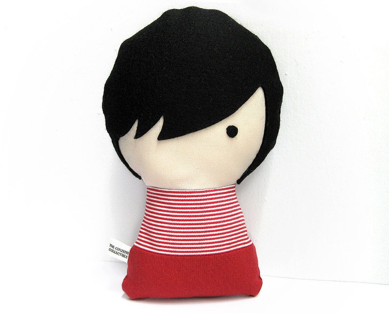 Custom made dolls resembling your beloved ones. The picture shows a sample of a woman with black hair with bangs, stripped red shirt and red skirt. You can order your doll and chose among many options. Made out of cotton and wool felt.