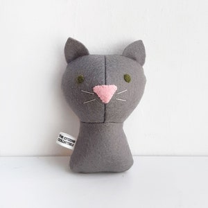 Custom made dolls resembling your beloved ones (humans or pets!). The picture shows a sample of a gray cat with green eyes. Made out of cotton and wool felt.