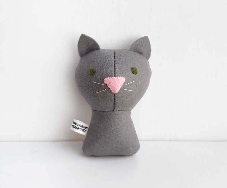 Custom made dolls resembling your beloved ones (humans or pets!). The picture shows a sample of a gray cat with green eyes. Made out of cotton and wool felt.