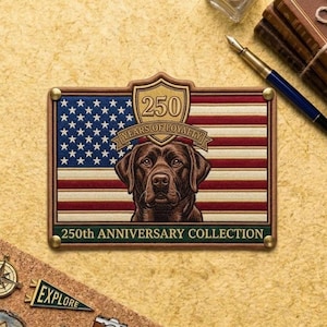 May include: Embroidered patch featuring a brown Labrador Retriever against an American flag design. The patch includes the text "250 Years of Loyalty" and "250th Anniversary Collection". The patch has a brown border with gold-colored rivets.