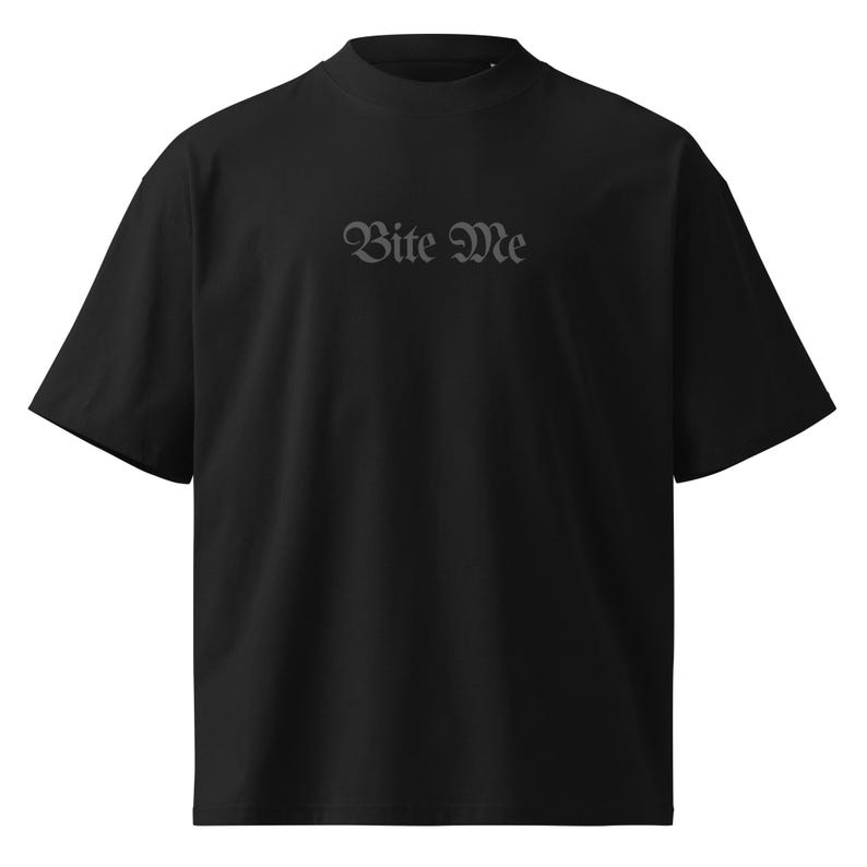 Front view black unisex t-shirt with small Bite Me gothic lettering minimalist statement design