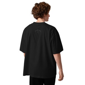 Back view of oversized black gothic shirt worn casually unisex alternative fashion fit