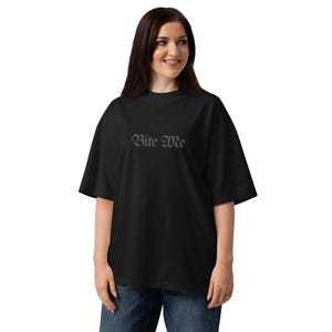 Full body view model wearing oversized Bite Me gothic typography shirt streetwear style