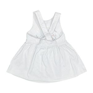 May include: White corduroy baby dress with a cross-back design. The dress features vertical stripes and a gathered skirt. The back has embroidered floral details. A cute and comfortable outfit for a baby or toddler.