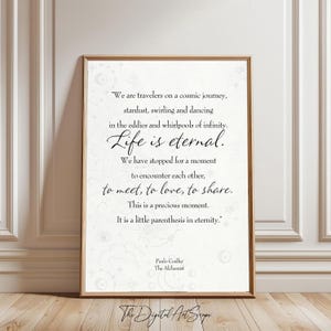May include: A framed art print featuring a quote by Paulo Coelho, with the words "Life is eternal" in elegant script. The design includes celestial motifs and the text "The Digital Art Scope" at the bottom.
