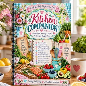 Può includere: Un libro a spirale Kitchen Companion con una copertina colorata che mostra illustrazioni di prodotti freschi, utensili da cucina e un elenco di sezioni per la pianificazione dei pasti. Il testo recita Kitchen Companion, Simple Ideas, Healthy Choices, A Stronger, Happier You e Nourish Your Body, Brighten Your Days.