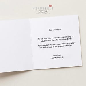 May include: An open white greeting card with text. The card's top left corner has the Heartfelt D&eacute;cor logo. The text reads: "Dear Customers. We can print your personal message inside your card, or leave it blank for you to handwrite."