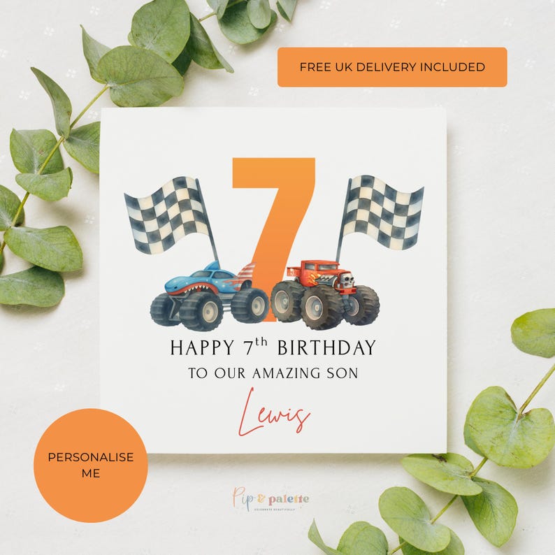 May include: A white birthday card with an orange number 7 and two monster trucks. The card reads "HAPPY 7th BIRTHDAY TO OUR AMAZING SON Lewis". Two checkered flags are on either side of the number.
