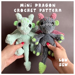 May include: Two crocheted mini dragon toys. One is light green with green and black accents, the other is gray with pink and green accents. The text "MINI DRAGON CROCHET PATTERN" and "LOW SEW" are visible.