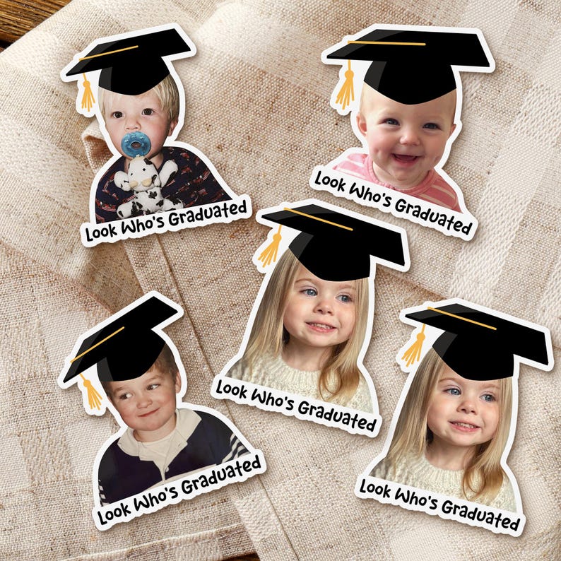 May include: Five stickers featuring children wearing graduation caps. Each sticker has a photo of a child and the text "Look Who's Graduated". The caps are black with a gold tassel. The children are of various ages and ethnicities.