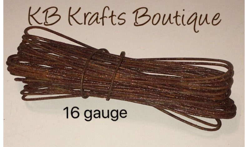 May include: A bundle of rusty brown 16 gauge wire.  The wire is coiled and tied together.  The text "KB Krafts Boutique" is visible at the top of the image.