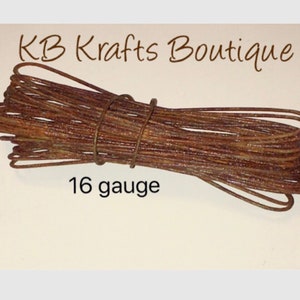 May include: A coil of rusty brown 16 gauge wire.  KB Krafts Boutique.