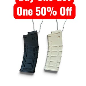 May include: Two curved firearm magazines, one black and one off-white, each hanging from a silver metal hook. Above the magazines is a red rectangular sign with white text that reads Buy One Get One 50% Off.