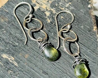 Peridot Teardrop gemstones on handforged Sterling Silver rings on our handforged ear wires