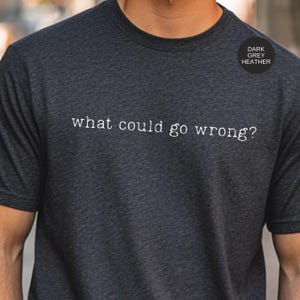 What Could Go Wrong Sarcastic Tee: Maroon Graphic Shirt, Vintage Washed Humor | Soft Fabric, Relaxed Fit, Express Yourself Dark Grey Heather