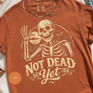Waving Skeleton Not Dead Yet Design, Funny Halloween Undead, Spooky Ghost Bat Motif, Vintage Grunge Art for all products

Halloween Design