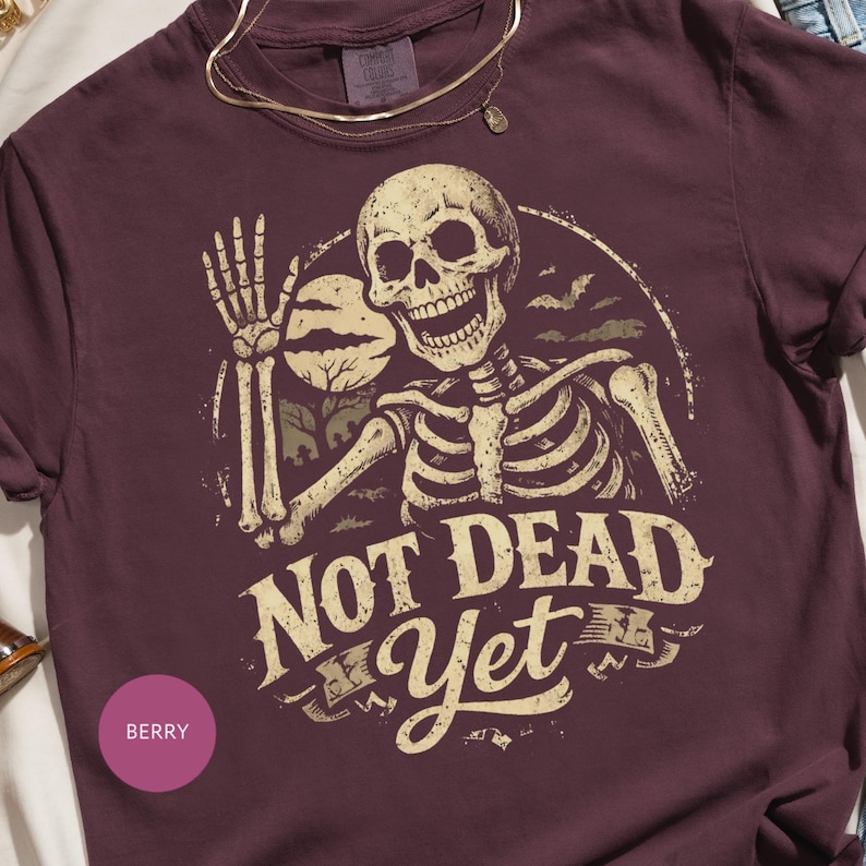 Not Dead Yet Skeleton Design, Funny Halloween Skull Graphic, Spooky Waving Bones, Vintage Bat Moon Art, Gothic Humor Print, Retro Distressed