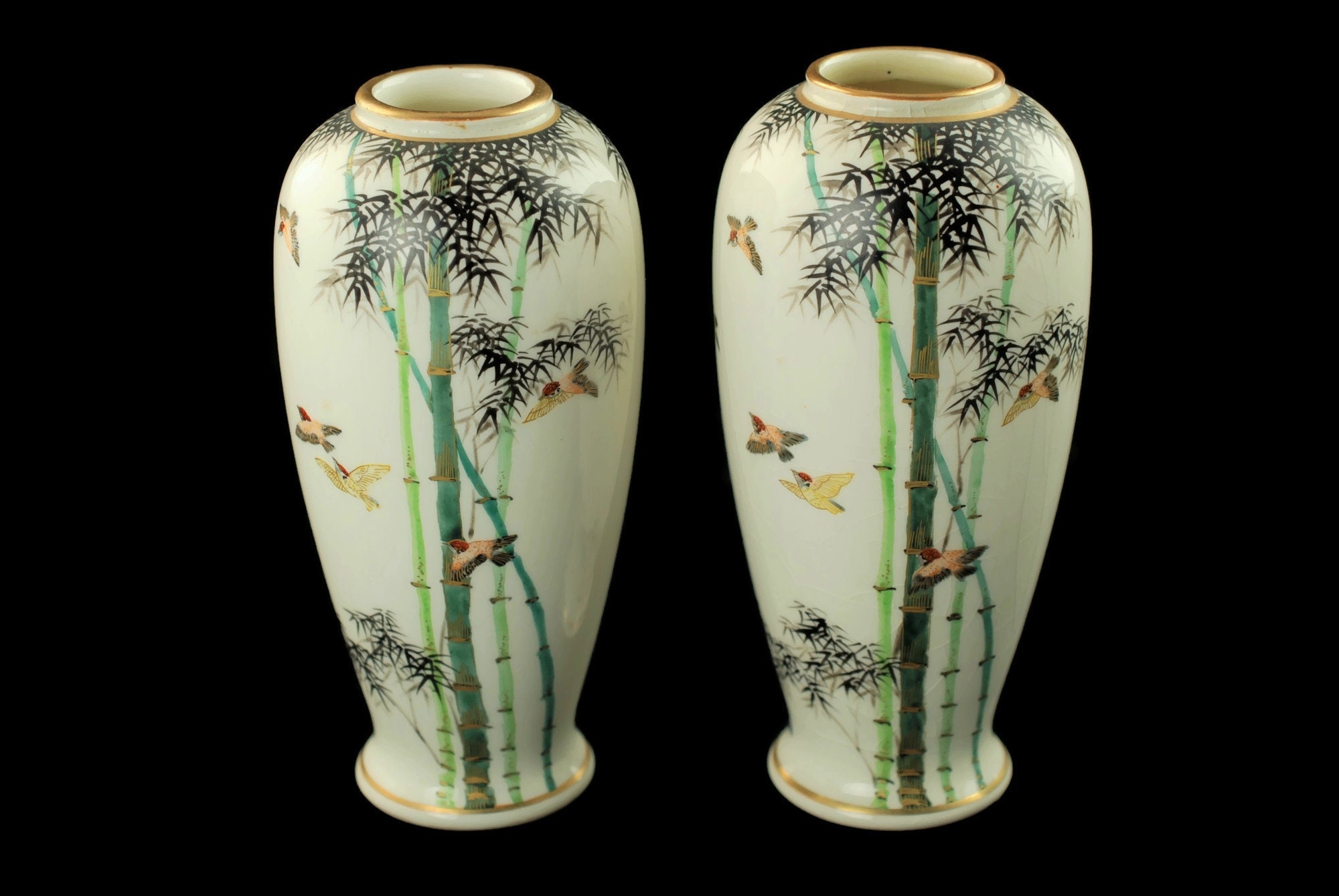 This elegant pair of Japanese porcelain baluster form cabinet vases were ma...